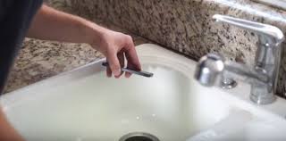 how to unclog a garbage disposal