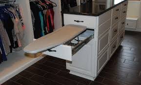 It doesn't seem to be a sturdy as a full sized stand alone board, but is great for the touch ups and small items we use it for. Ironing Board Cabinet Extensions For Organized Laundry Rooms