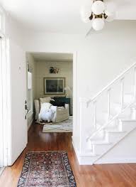 Most home staircases are constructed of wood. Rachel Schultz Painting A Staircase White