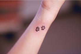 Dog paw print tattoos are very cute and relatively small and simple compare to other tattoos. 55 Robust Dog Tattoo Designs For Girls