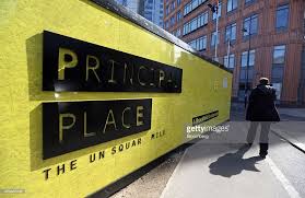 A Pedestrian Passes A Hoarding Surrounding The Construction Site Of Hoarding Design Real Estate Sign Design Construction