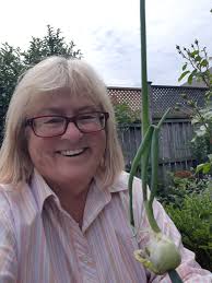 Should I cut back yellowing walking onion tips?