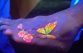 Beautiful Butterfly Black Light Tattoo On Foot Black Light Tattoo Foot Tattoos Butterfly Foot Tattoo