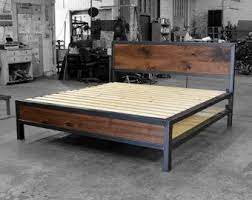 kraftig platform bed with rough walnut headboard in 2021 bed frame design industrial bed frame welded furniture
