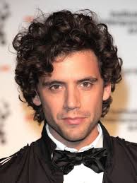 This Is Mika A Famous British Singer He Is Alive And His Hair Reminds Me The Style Used In 1800 His Shor Curly Hair Men Men S Curly Hairstyles Wavy Hair Men