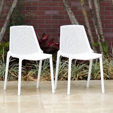 Wrought Studio Haymarket Stacking Patio Dining Chair Wayfair In 2020 Patio Dining Chairs Resin Patio Furniture Outdoor Dining Chairs