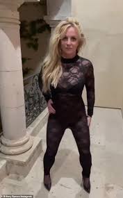 #freebritney activists protest at los angeles grand park during a conservatorship hearing for britney spears on june 23, 2021 in los angeles, california. Britney Spears Dons A Lace And Leather Jumpsuit And Plunging Floral Dress In A Playful Instagram Mashup Oltnews