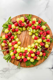 21 fun christmas fruit ideas for dessert, dinner, and more ; Christmas Fruit Wreath This Healthy Table