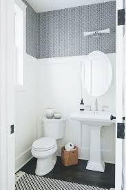 Transitional Powder Room With Blue Wallpaper Above Board And Batten Trim Showcasing A Pedestal S Powder Room Small Transitional Powder Room Powder Room Remodel