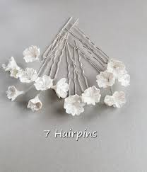 Maybe you would like to learn more about one of these? Bridal Hair Pins With Small White Flowers Wedding Hair Piece Etsy Flower Hair Accessories Wedding White Flowers Wedding Hair Wedding Flower Hair Pieces