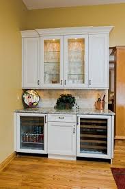 If there is a way you can pull the cabinet away from the wall with the top in tact, you can use a thin tape knife (wide putty knife) to slide between the top and cabinet or you can use a handsaw from the back side of the cabinet to break the adhesive loose. Naperville Residence Kitchen Breakfast Room Dry Bar Traditional Games Room Chicago By Gina Bon Airoom Architects Builders Llc Houzz Ie