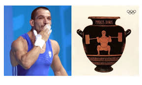 Σαν σήμερα, στις 26 ιουλίου του 1996, ο αρσιβαρίστας και χρυσός ολυμπιονίκης, είχε κατακτήσει το δεύτερο σερί χρυσό μετάλλιό του στους ολυμπιακούς αγώνες της ατλάντα στις ηπα. Pyrros Dhmas To Onoma Kai H Morfh Toy Se Arxaioellhniko Aggeio Apo Thn Die8nh Olympiakh Epitroph Orizontes