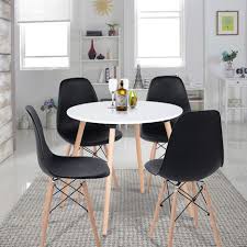 Les chaises longues et la table sont élégantes et confortables à utiliser. Ensemble Table A Manger Ronde Et Lot De 4 Chaises Scandinave Blanche Noir Bois Meuble Express Pas Cher A Prix Auchan