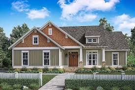 One small flight of stairs leads up to the top floor, while another short set of stairs leads down. Split Level Home Plans Family Home Plans