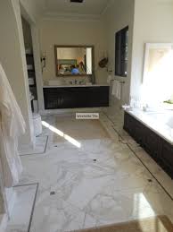 Black And Gold Marble Bathroom Tiles Calacatta Gold 18x18 Marble Installed In Diagonal Pattern Lagos Azul 1 X1 Mosaic As Mos Patterned Bathroom Tiles White Marble Bathrooms Modern Bathroom Decor