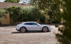 The porsche taycan cross turismo has been revealed as a more practical alternative to the taycan electric car. Porsche Unveils Taycan Cross Turismo A Lightening Quick Electric Estate