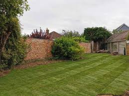 When the rolls arrive store them in the shade and make a good way to do this is to insert wooden stakes into the ground, choosing key points along the area you're turfing. Lawn Maintenance New Turfing Perfect Grass For Your Garden