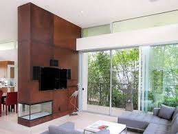 Corten Steel In Indoor 60 Ideas In Rust Look Double Sided Fireplace Fireplace Design Freestanding Fireplace
