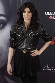 Penelope Cruz In A Versacess18 Look With Stud Embellished Leather Jacket And Medusa Belt At The Loving Pablo Photo Call In Ma Versace Fashion Gianni Versace