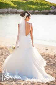 A Floral Veil Is The Perfect Way To Accessorize For A Wedding In Aulani Hawaii Beach Wedding Bridal Headwear Beach Wedding Veil Wedding Hairstyles With Veil