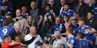 Raging Leicester fans fight in stands as they turn on each other after they  are relegated from Premier League | The Sun