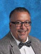 Andrew “Andy” Perry, 52, who won Teacher of the Year in 2012, was killed in  a car crash