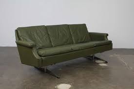 The 6 glamorous gold polished stainless steel legs provide a sturdy support this cozy stunner.the max weight capacity is 700lb. Danish Mid Century Modern Green Leather Sofa With Metal Legs At 1stdibs