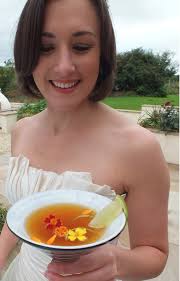 Dark and Stormy Cocktail with Tagetes Flowers.