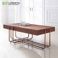 A solid walnut base and spindle shelf gives you room to stash your latest design magazines, favorite architecture books, and that handmade ceramic bowl you picked up the last time you were in hawaii. China Rectangle Walnut Veneer Mdf Coffee Table With Rose Gold Stainless Steel Leg China Coffee Table Glass Coffee Tables