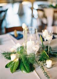 22 Ways To Decorate With Magnolia Leaves Magnolia Leaves Centerpiece Succulent Wedding Centerpieces Magnolia Leaves Wedding