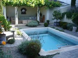 This Mediterranean Style Garden Is A Beautiful Setting For The Endless Pool Endless Pool Small Swimming Pools Pool Houses
