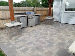 Cambridge maytrx wall, pyzique fire pit, round table pavers. Brick Pavers Driveways Patios Walkways Landcare Lawn Maintenance