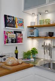 Bookshelf directly above kitchen sink. 15 Unique Kitchen Ideas For Storing Cookbooks