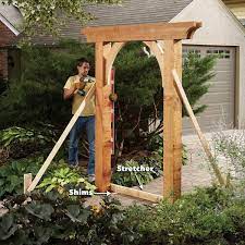Build A Garden Arch The Family Handyman Garden Arches Garden Archway Outdoor Pergola