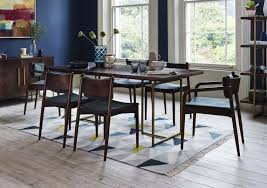 The set dates from the art deco / art nouveau period, circa 1915 and is made of solid pear wood. Art Deco Dining Table Furniture Village