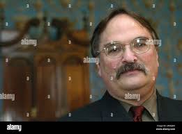 Rhode Island Historical Society executive director Bernard Fishman stands  in front of a "nine-shell" block-front desk commissioned by Providence  merchant Joseph Brown in the late 18th century, Thursday, Feb. 10, 2005, at