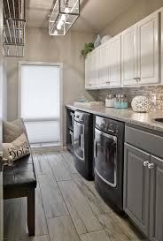This laundry room from harrison design has lots going for it with its shiplap walls, designated basket storage, farm sink, hanging rod and counter workspace. Laundry Room Tile Floor Ideas Luxury Laundry Room Tile Floor Home Design Laundry Room Flooring Laundry Room Tile Modern Laundry Rooms