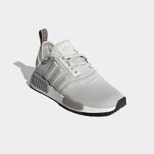 Though these shoes contain subtle nods to the '80s, the design stands on its own. Shop Women S Nmd R1 S In Beige From Adidas Grab A Pair Of Your Favorite Light Grey Sneaker Style For Women Th Nmd Adidas Women Adidas Nmd Womens Tennis Shoes
