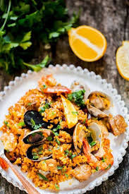 Chicken And Seafood Paella Chicken And Seafood Paella A Classic Spanish Rice Dish Made With Arborio In 2020 Paella Recipe Seafood Paella Recipe Paella Recipe Easy