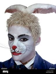 Yat Sen Chang as the White Rabbit in Derek Deane's production of Alice In  Wonderland for English National Ballet Stock Photo