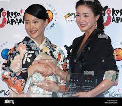 TOKYO, Japan - Japanese actress Yoshino Kimura (L) and South Korean actress  Choi Ji Woo pose for photos at a Tokyo hotel on July 22 after being named  goodwill ambassadors to promote