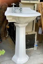 unbranded white pedestal bathroom sinks