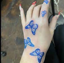 Butterfly Hand Tattoo Butterfly Tattoos On Arm Blue Butterfly Tattoo