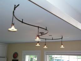 Vaulted ceilings can create a striking look in any room, making spaces feel larger and more open. Lighting Scorpio Interiors