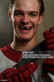DU hockey player Carter Mazur poses for a portrait