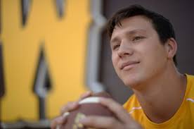 Josh Allen, Wyoming QB, looks to take out insurance against injury