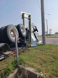 Russell man hospitalized after 2 semi trucks crash