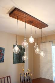 Hi, i need a recommendation for a dining room light fixture that will hang above the dining room table, but also provide enough light for the entire room. 34 Diy Chandeliers To Light Up Your Life Living Room Light Fixtures Rustic Light Fixtures Rustic Lighting