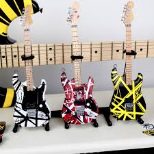 In the exhibit's guitar gods section, eddie van halen's 1975 frankenstein red, black, and white guitar is in a glass display, where you can fully see both the front and back of the fender that he took to with a chisel and a hammer to cut holes to make room for a gibson pickup, and later painted—twice. Officially Licenced Evh Set Of 3 Eddie Van Halen Mini Guitar Replica Collectibles Axe Heaven Touch Of Modern
