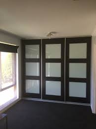 A round rain shower head is fixed to white and gray marble shower ceiling over black floor tiles ending at a marble bench fixed against a marble surround. Sliding Door Wardrobes Image Robes Adelaide Built In Robes Sliding Wardrobe Systems Genuine Low Prices On Adelaide Robes